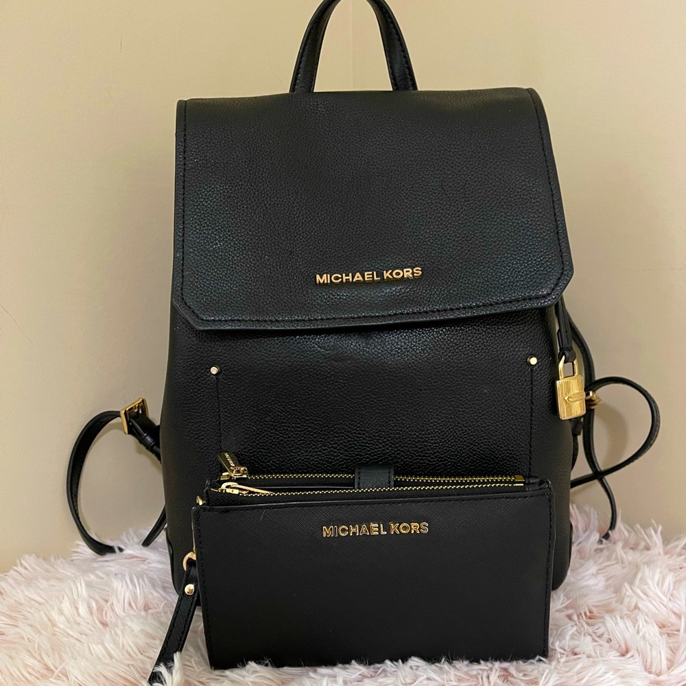 SOLD - Black Michael Kors backpack and wallet set.
